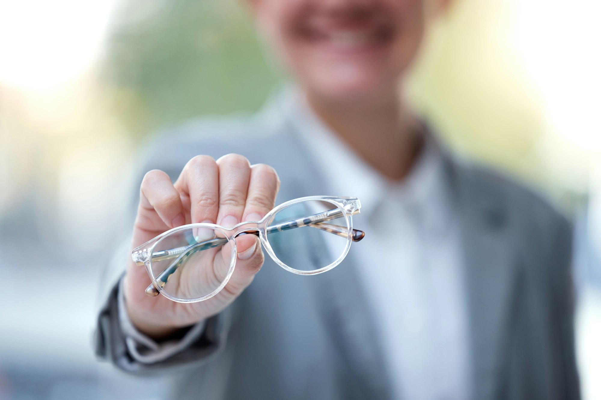 Frame, optometry and hands with glasses for eyes for eye exam, vision testing and optician store. O